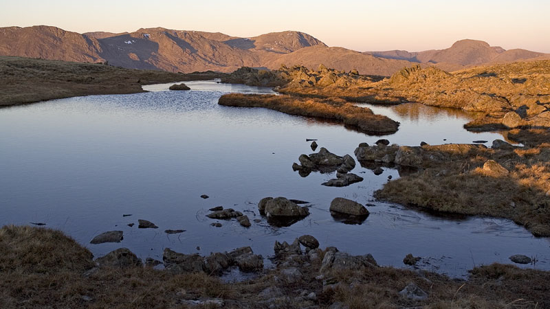 Dawn light over Thunacar Knott tarn