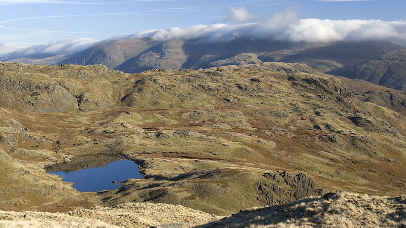 Codale Tarn & mist on Helvellyn ridge
