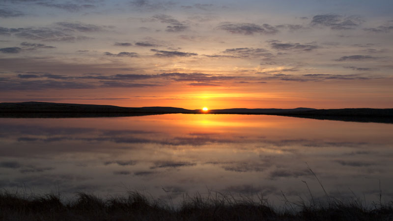 Sunrise over West Baugh Fell Tarn Sunrise over West Baugh Fell Tarn