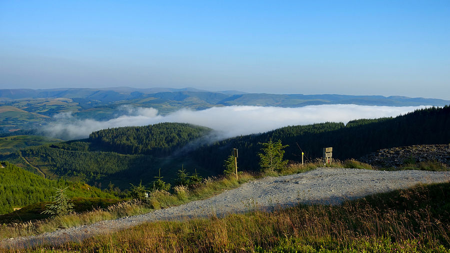 Inverted dense mist rolls inland above the Dyfi estuary